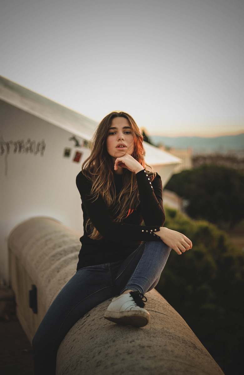 human woman wearing black long-sleeved top person