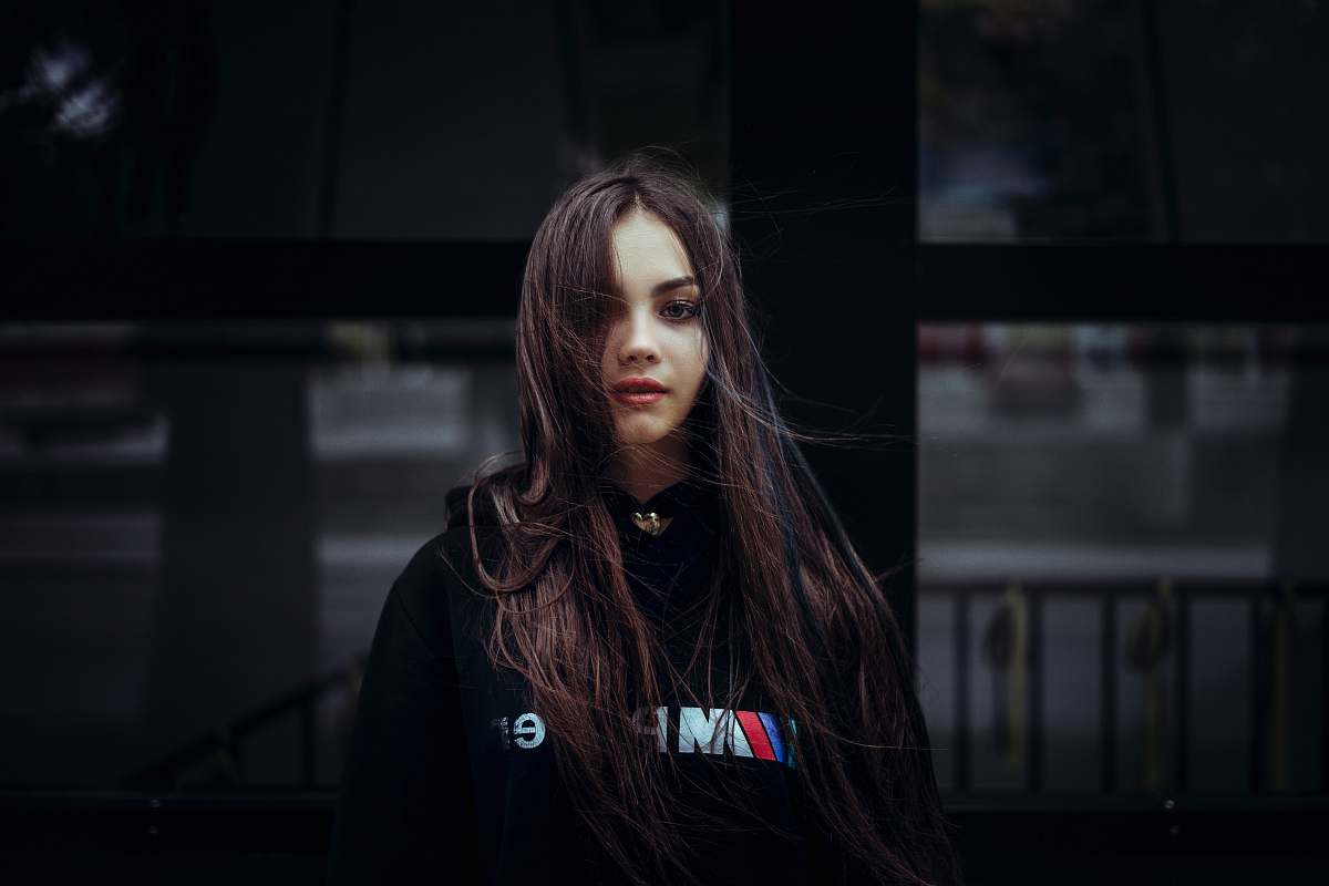 human woman wearing black pullover hoodie person