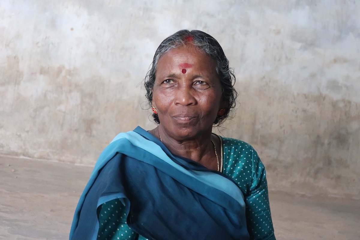 human woman wearing blue and teal polka-dot sari dress person