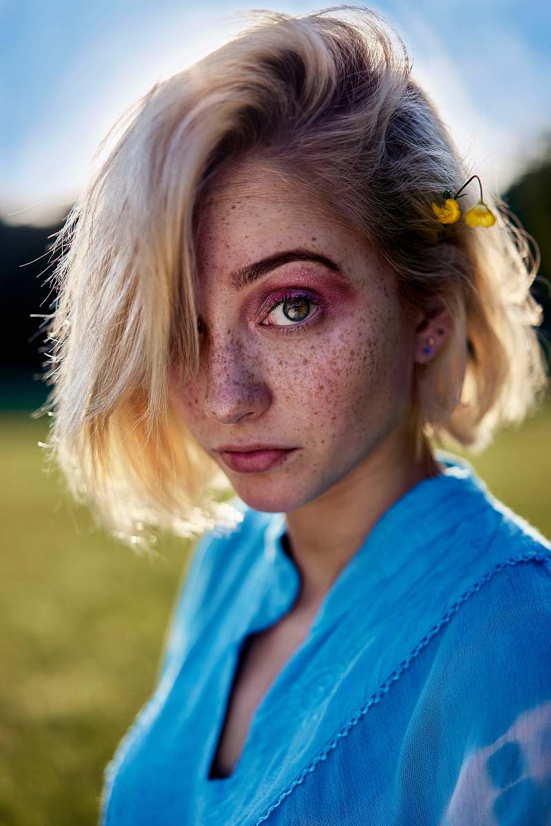 human woman wearing blue scoop-neck top person