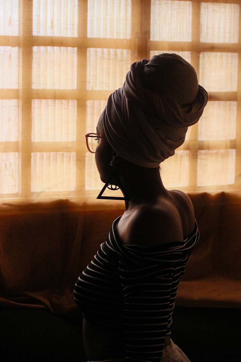 human woman wearing eyeglasses facing window person
