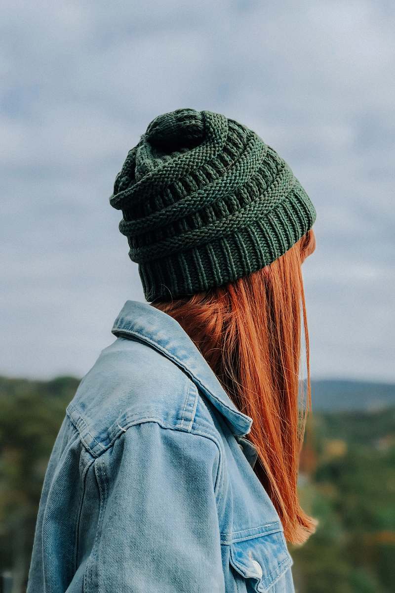 hat woman wearing green knit cap and blue denim jacket human