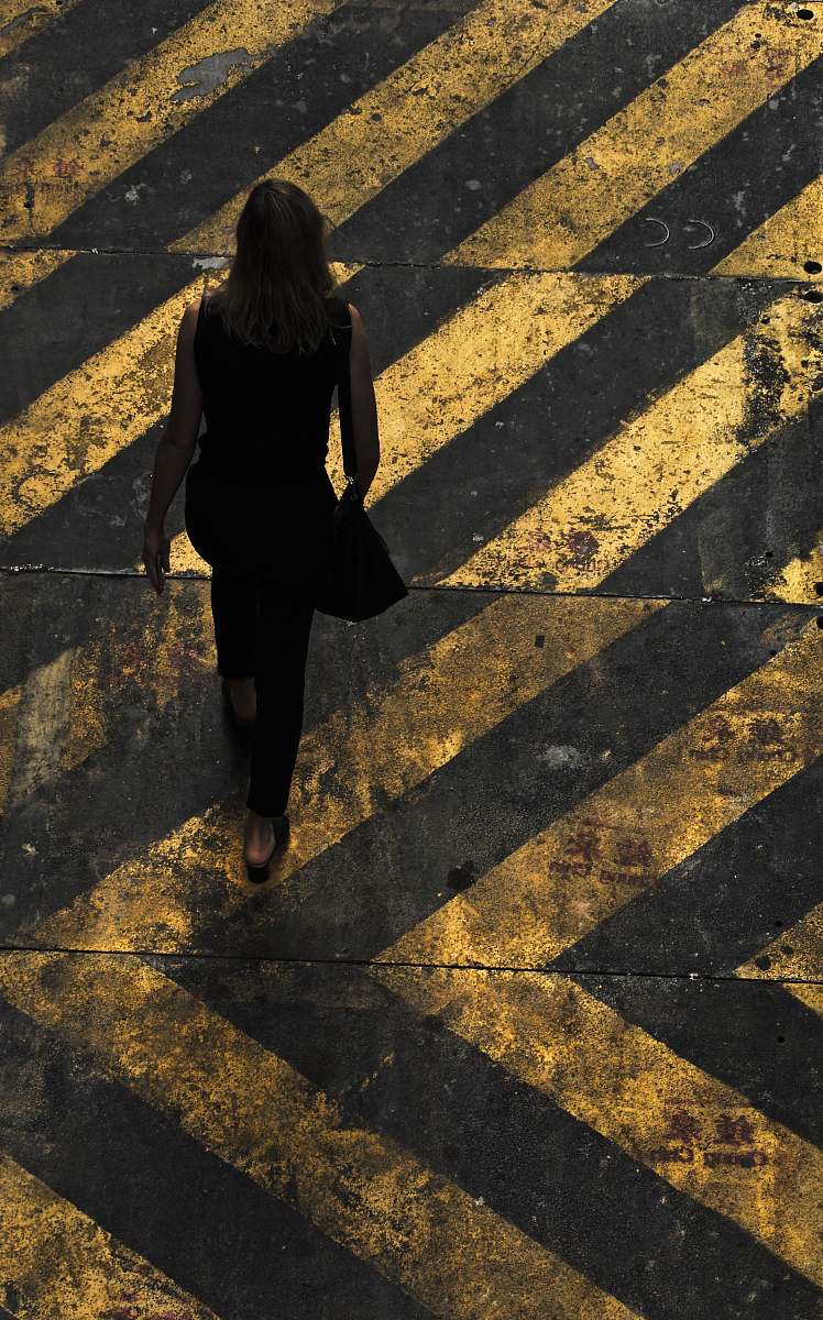 human woman with shoulder walking on pedestrian lane person
