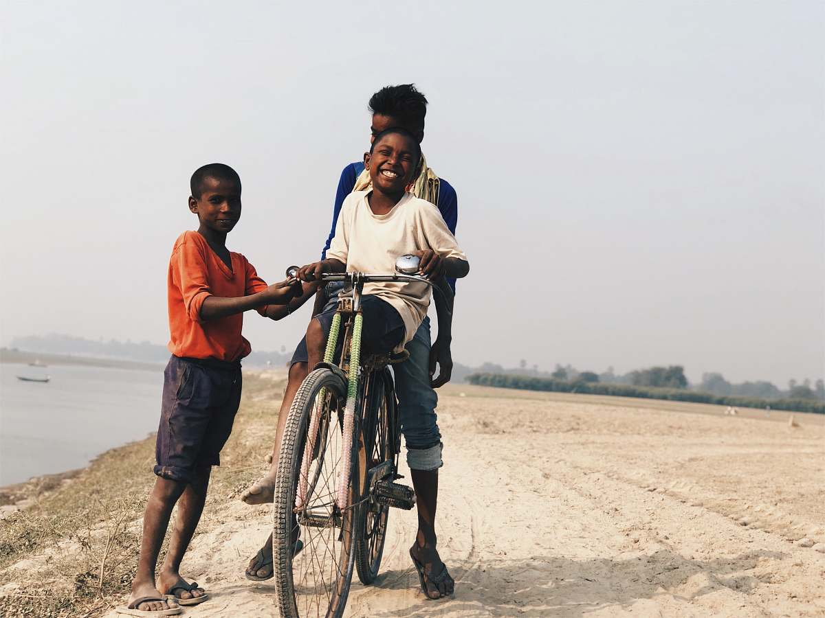 people boy riding on bike human