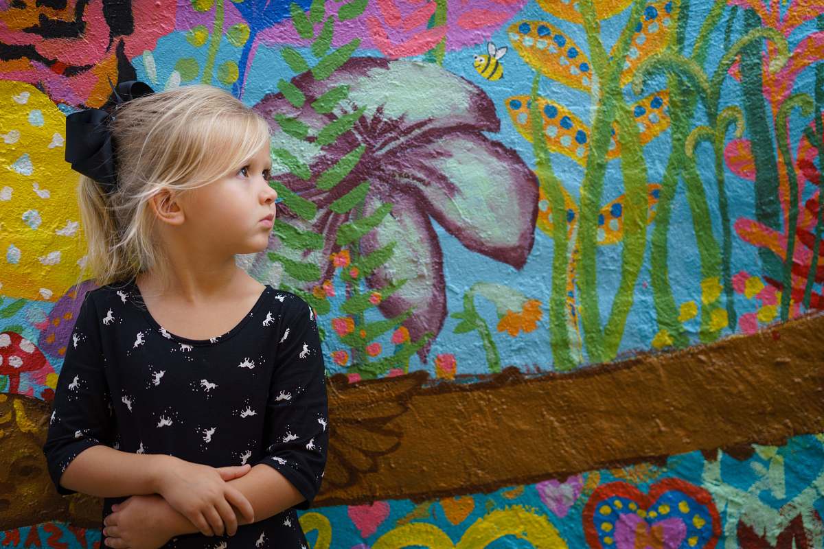 people girl leaning on floral wall human