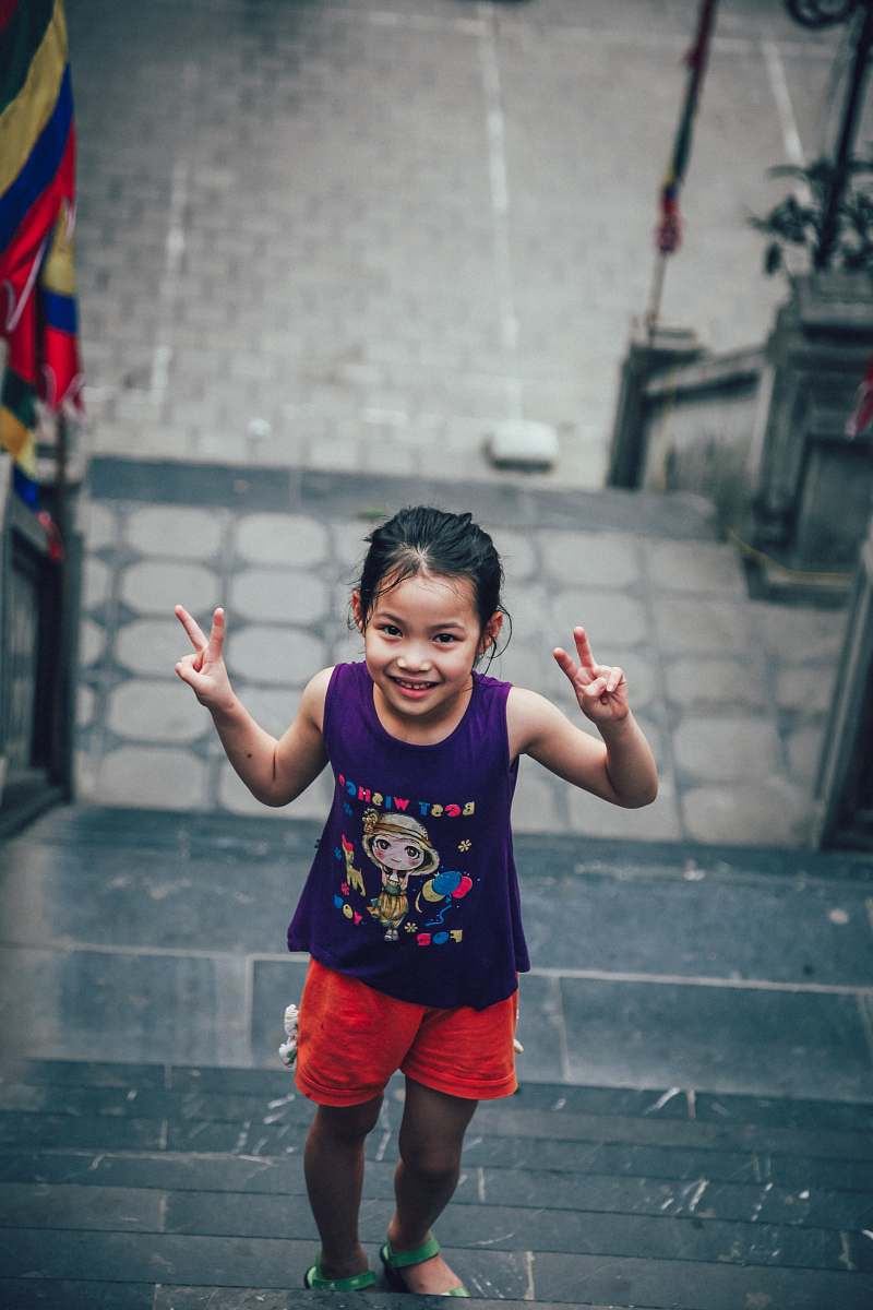human girl showing peace sign people