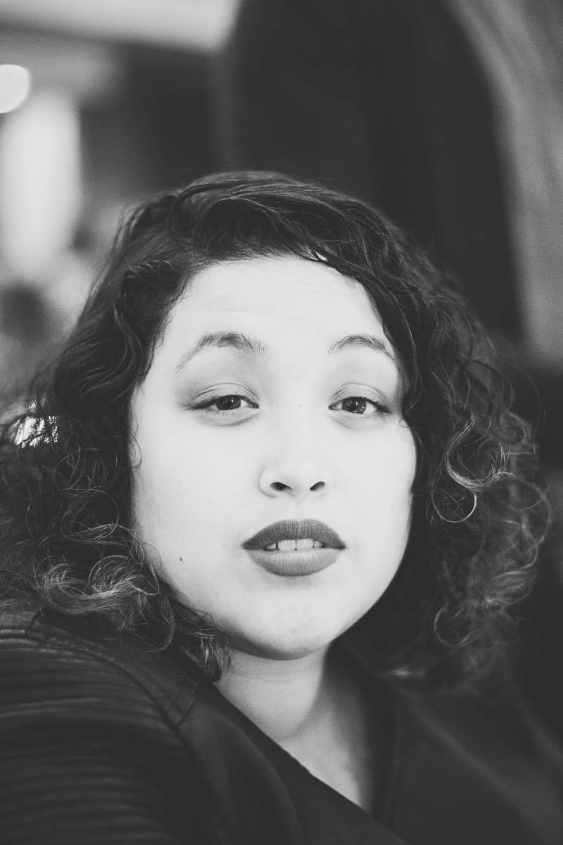 black-and-white grayscale photo of woman wearing top grey