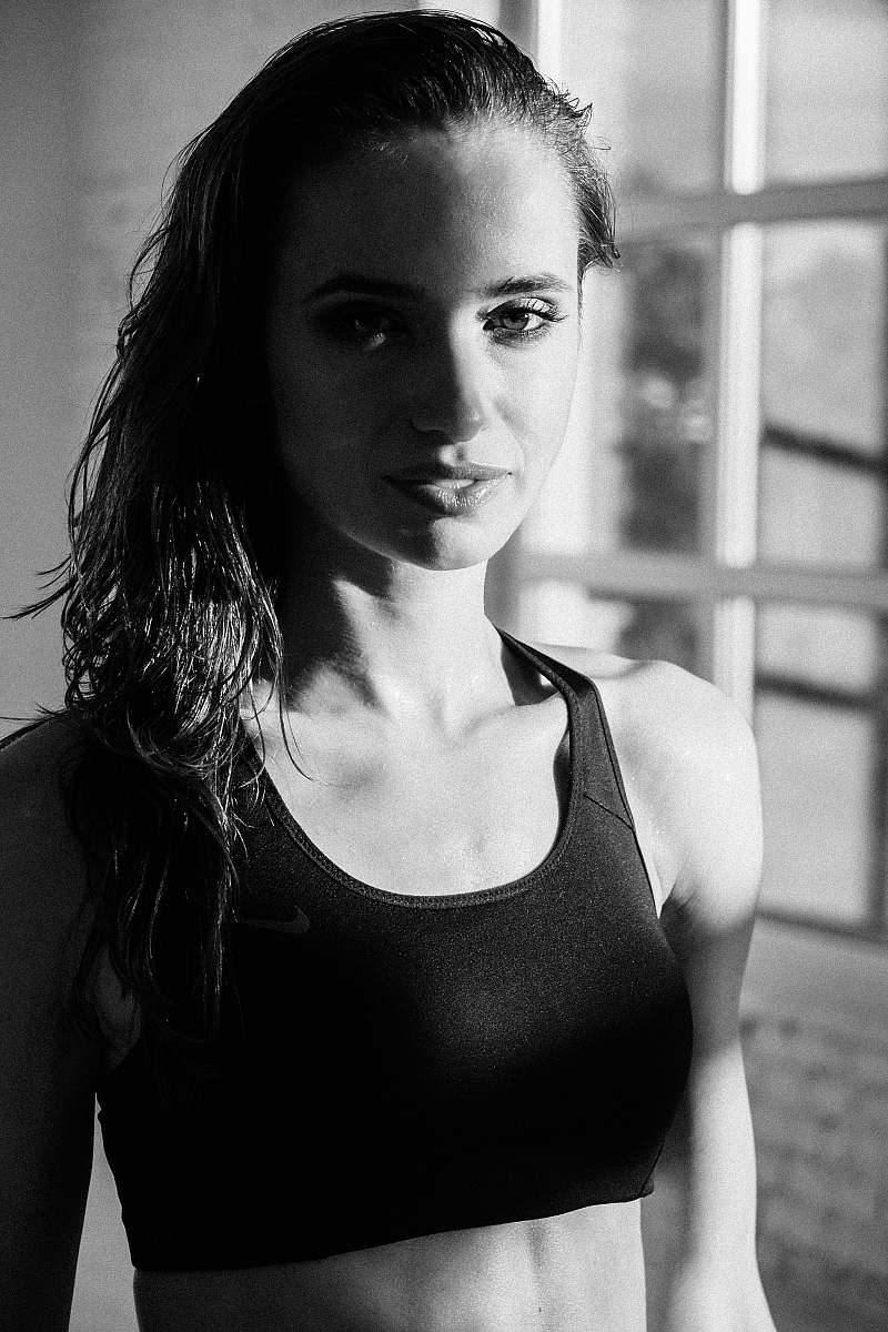 human grayscale photography of woman wearing sports bra black-and-white
