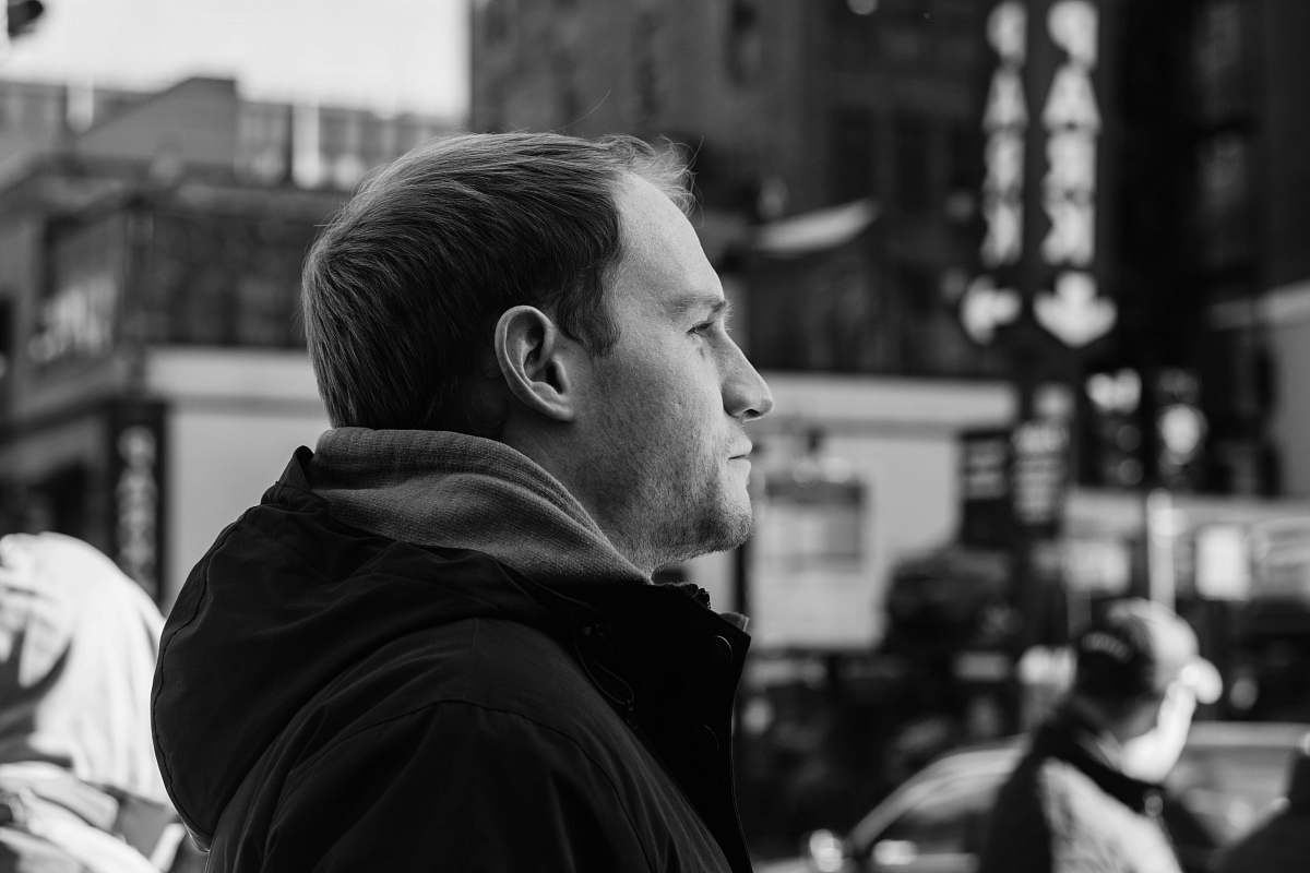 people greyscale photography of man looking far away black-and-white