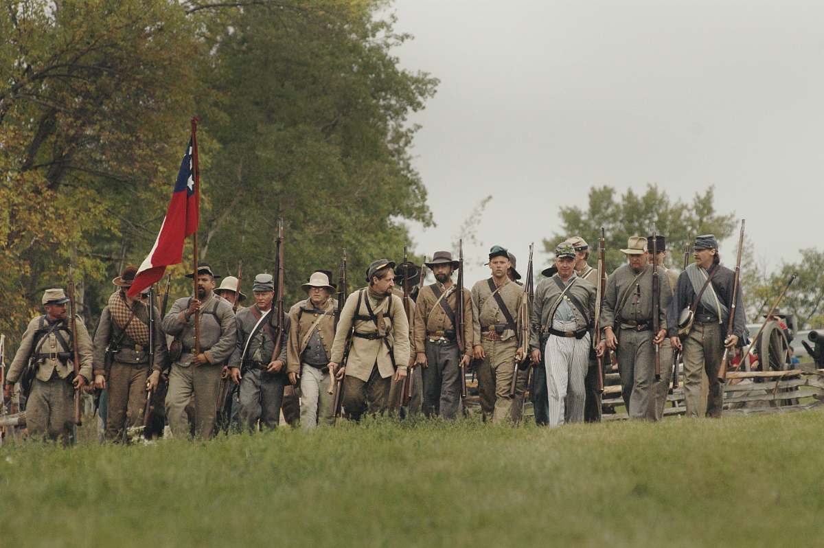 army group of men holding hunting gun and flag human