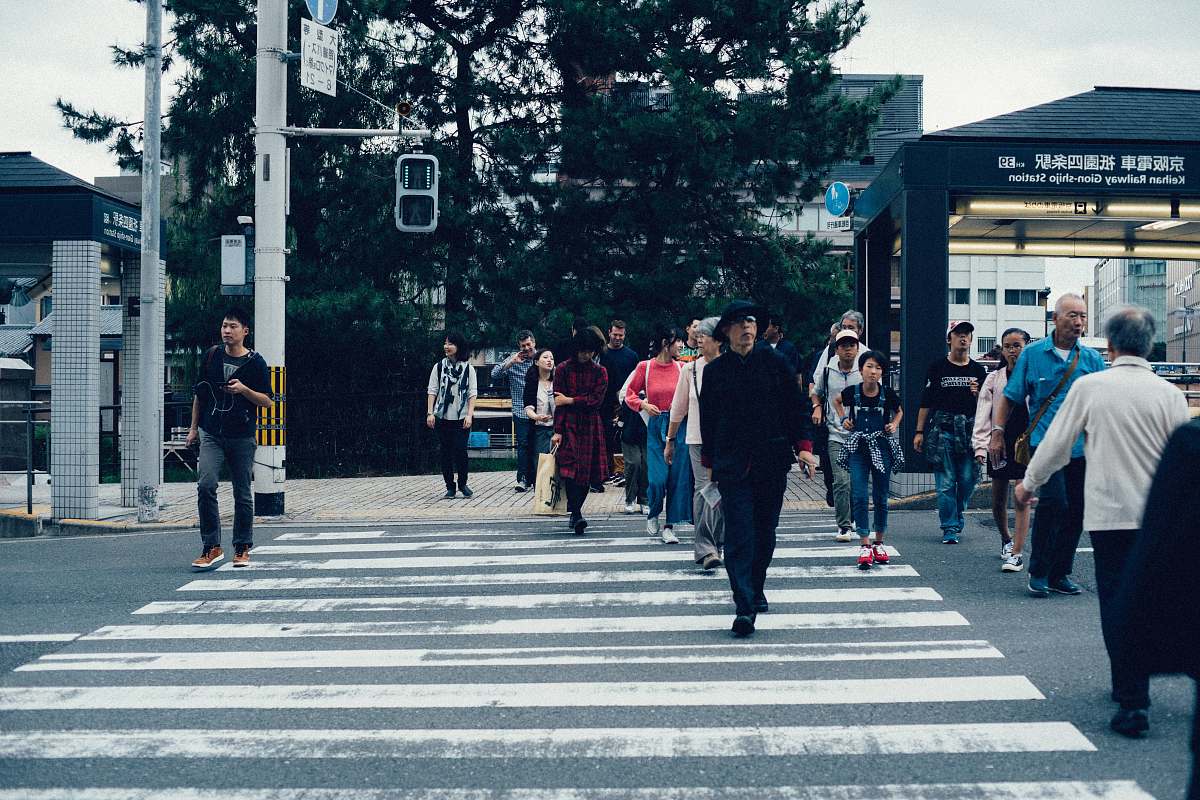 human group of people walking on road people