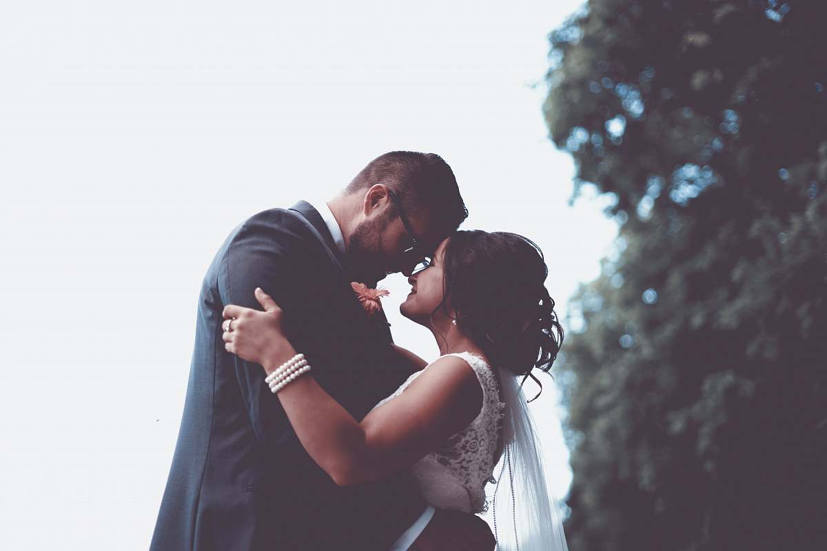 human man and woman holding and looking each other people