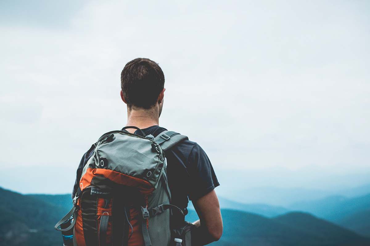 backpack man carrying hiking bag outdoors mountains