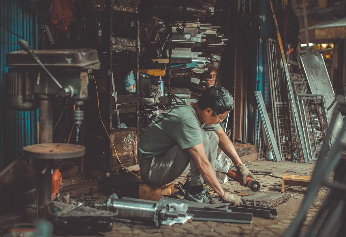 people man holding angle grinder human