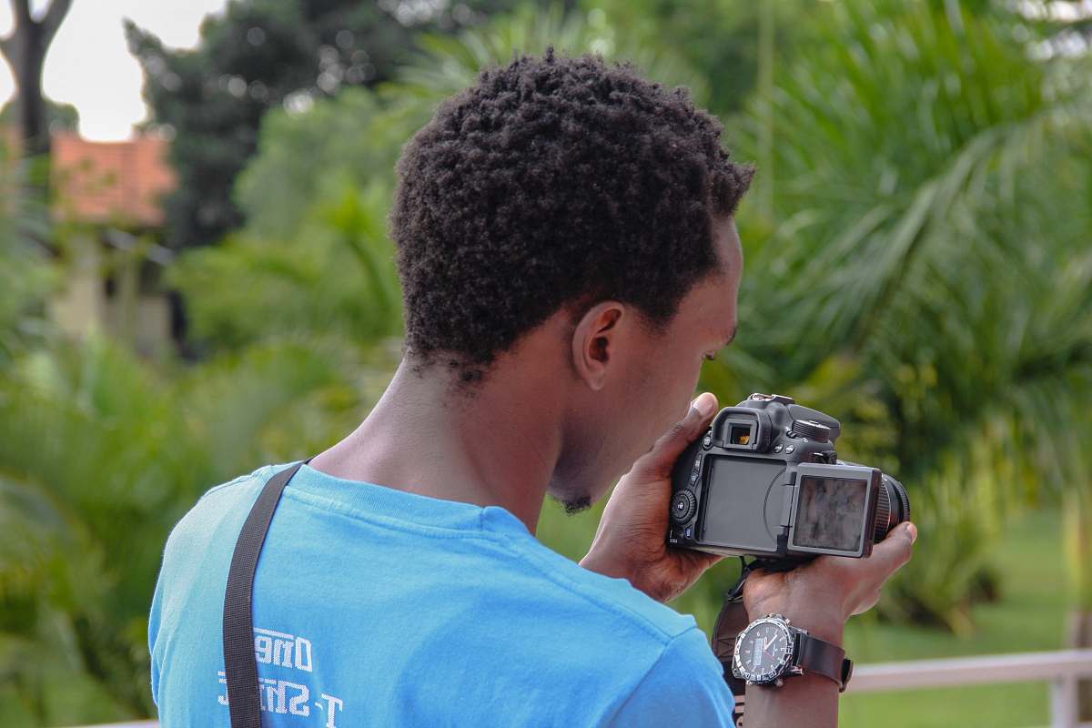 people man holding camera photo human