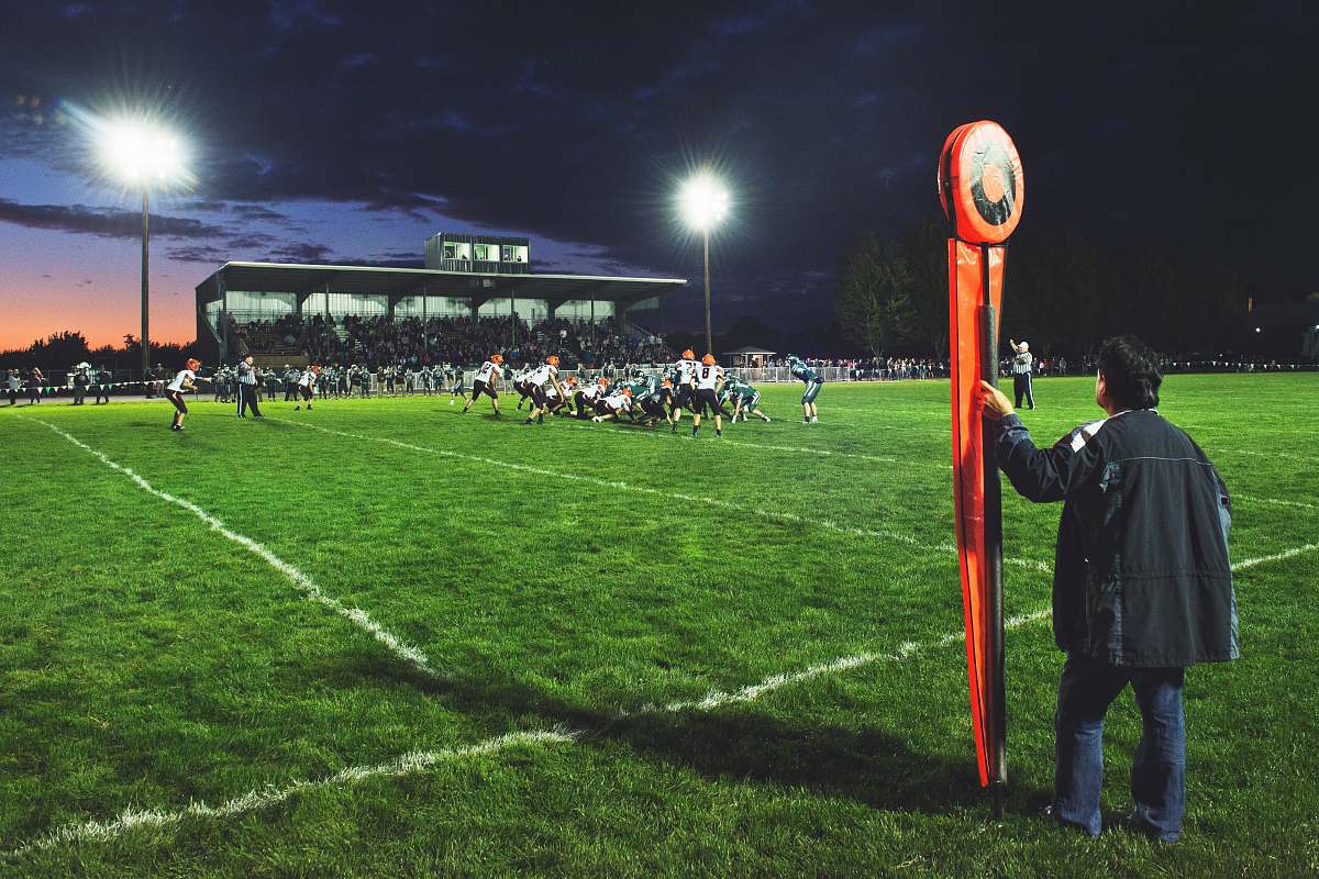 people man holding football field post on side of field human