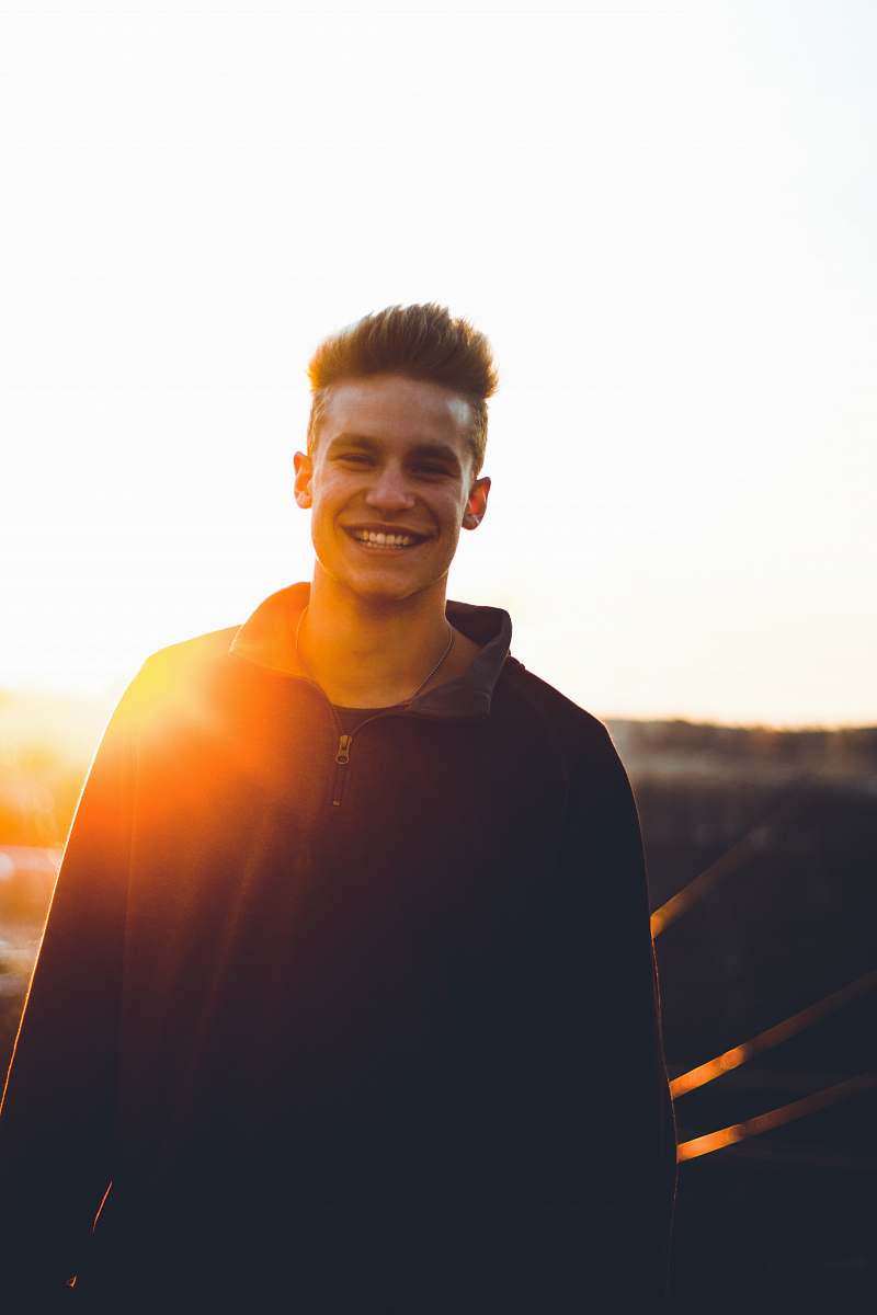 human man in black sweater smiling people