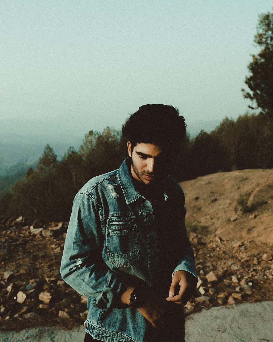 human man in blue denim jacket standing people