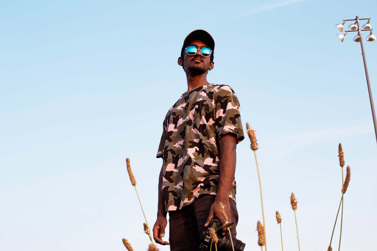 people man in brown and black camouflage and black bottoms outfit human