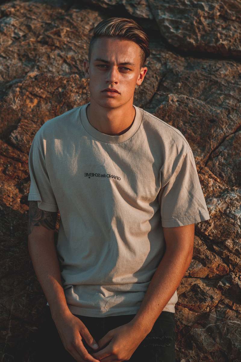 People Man Leaning On Rock While Posing Human Image Free Photo