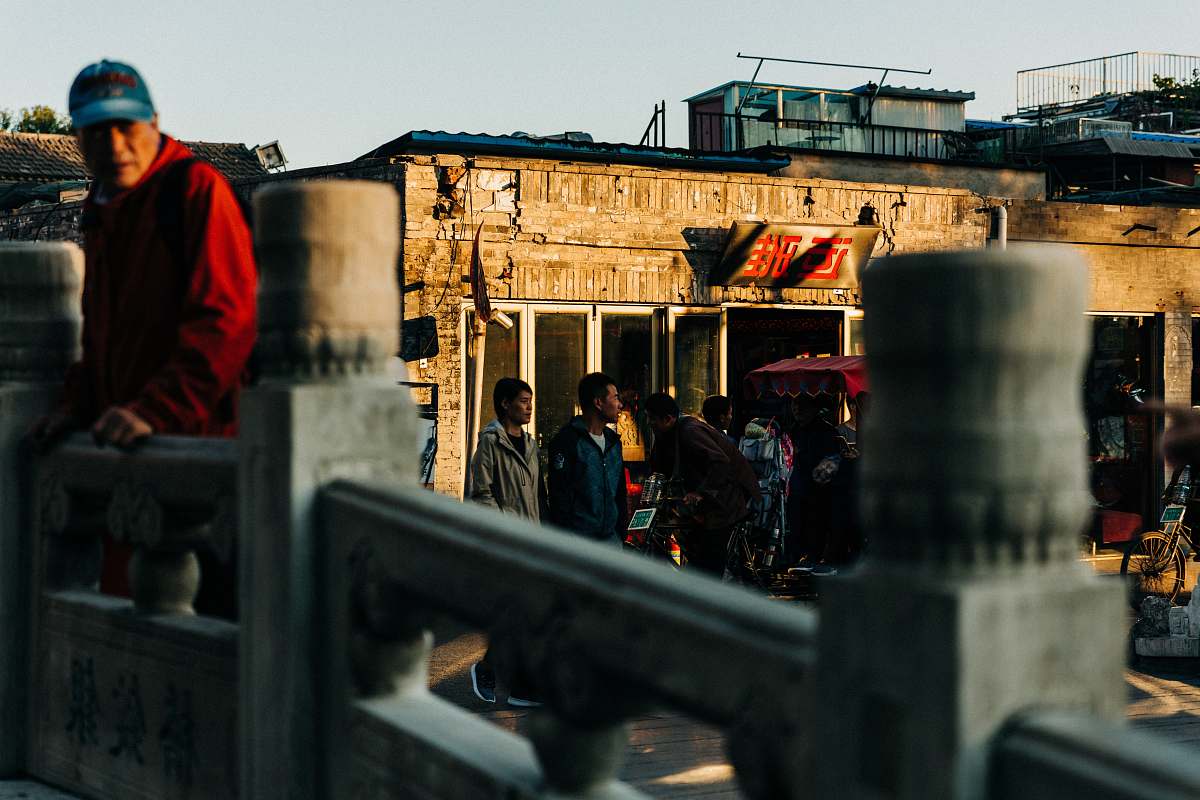 human man leaning on wall people