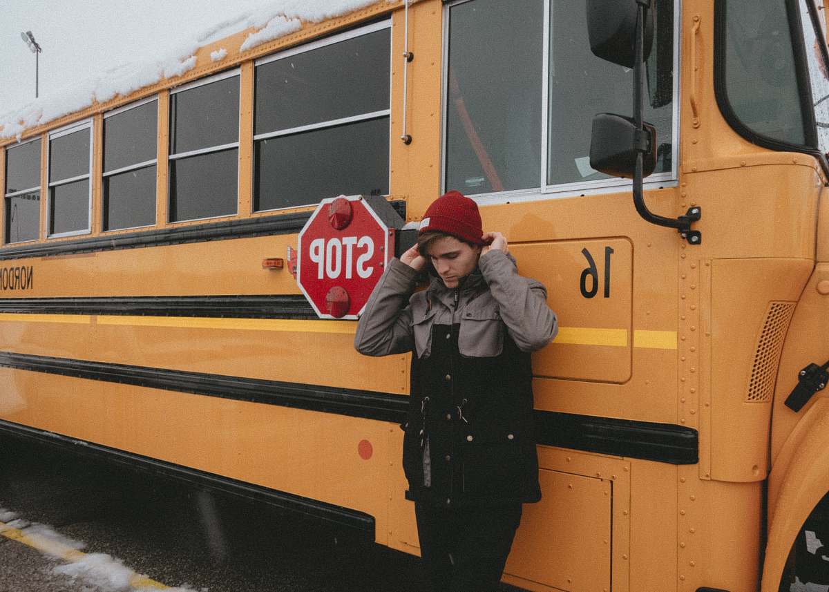 people man leaning on yellow bus human