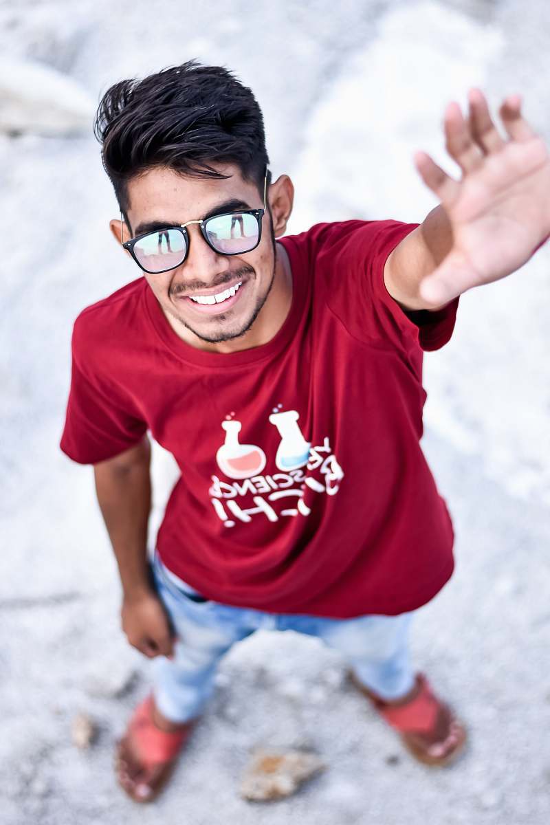 human man raising left hand while standing people