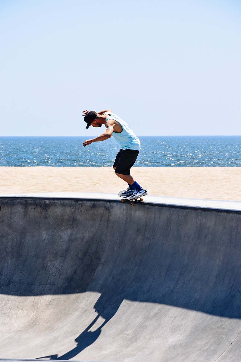 human man riding skateboard doing trick people