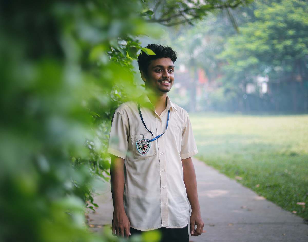 human man standing beside tree people
