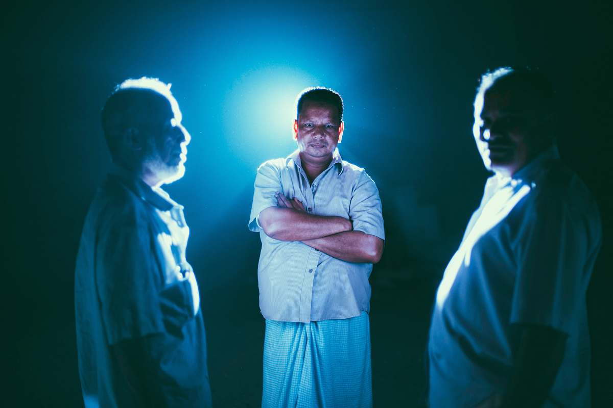 human man standing between two men people