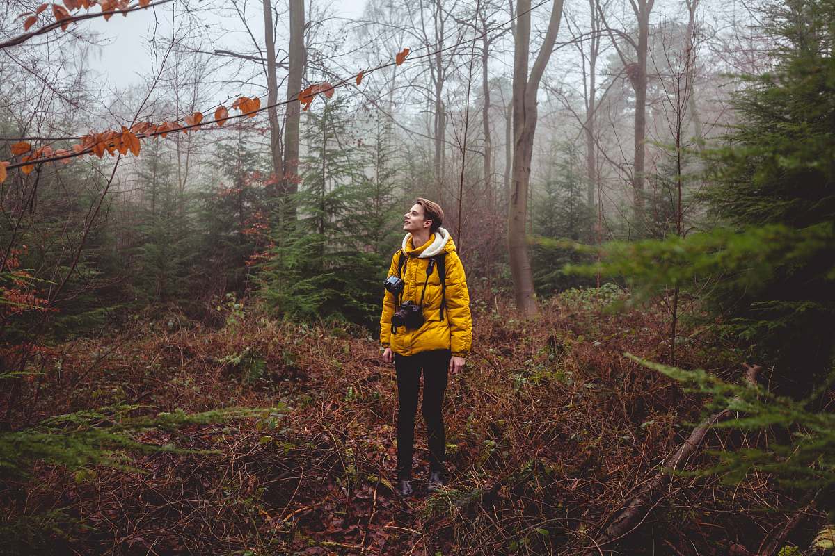 human man standing in forest during daytime people