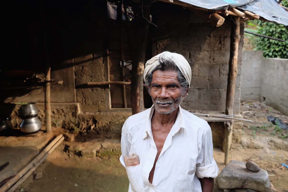 human man standing in front of house people