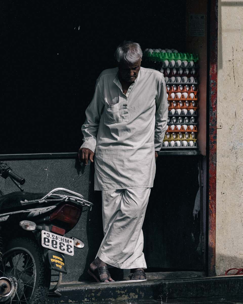 human man standing near motorcycle motorcycle