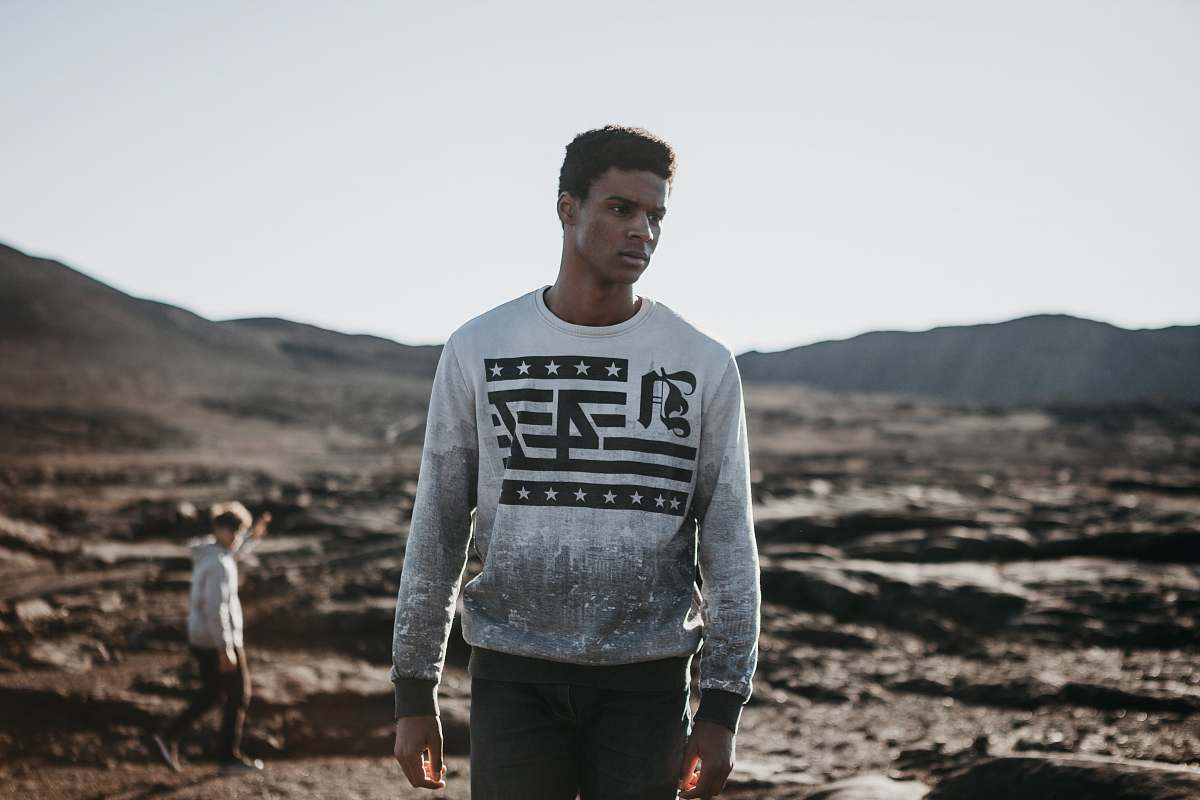 people man standing on field at daytime human
