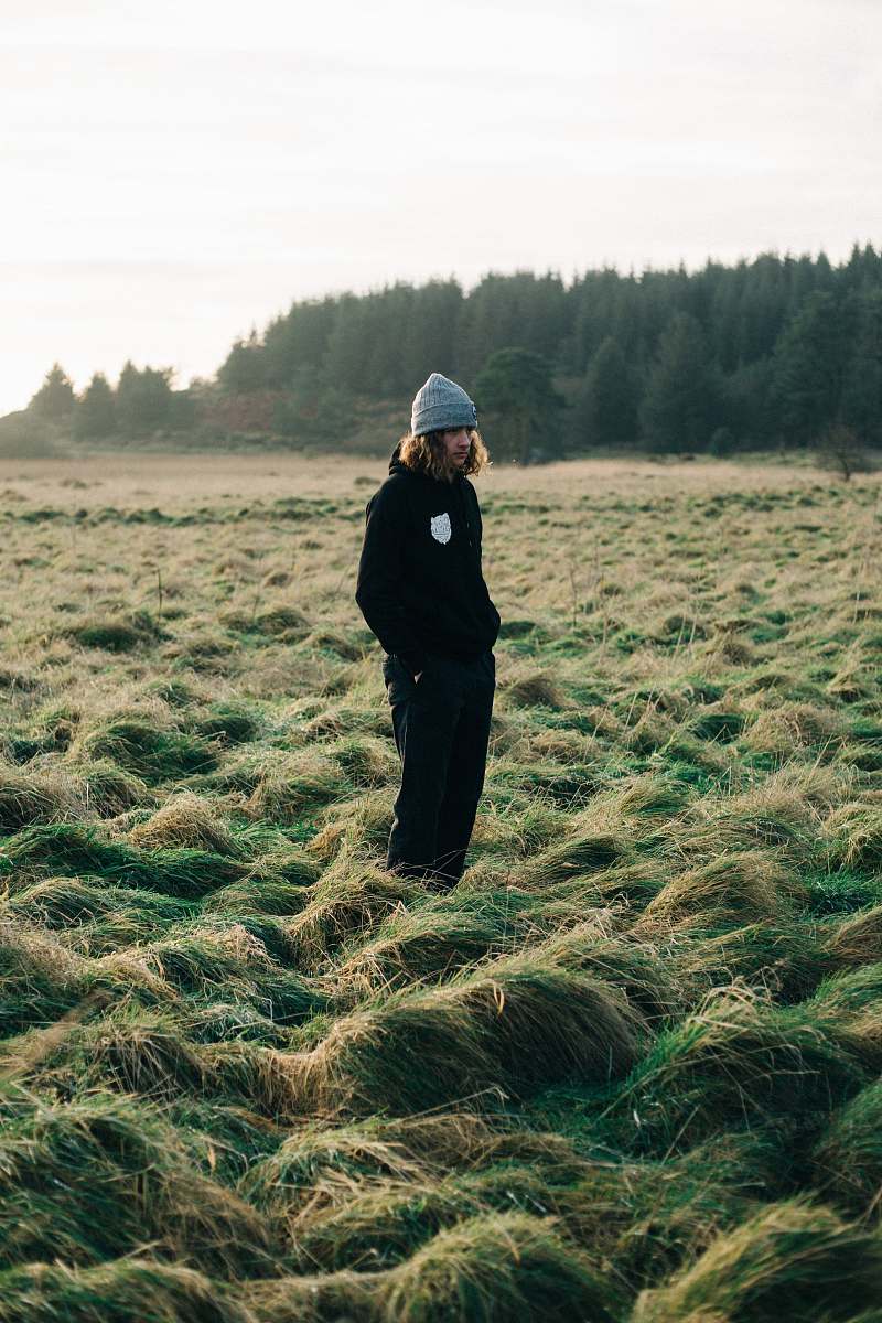 human man standing on green grass field people