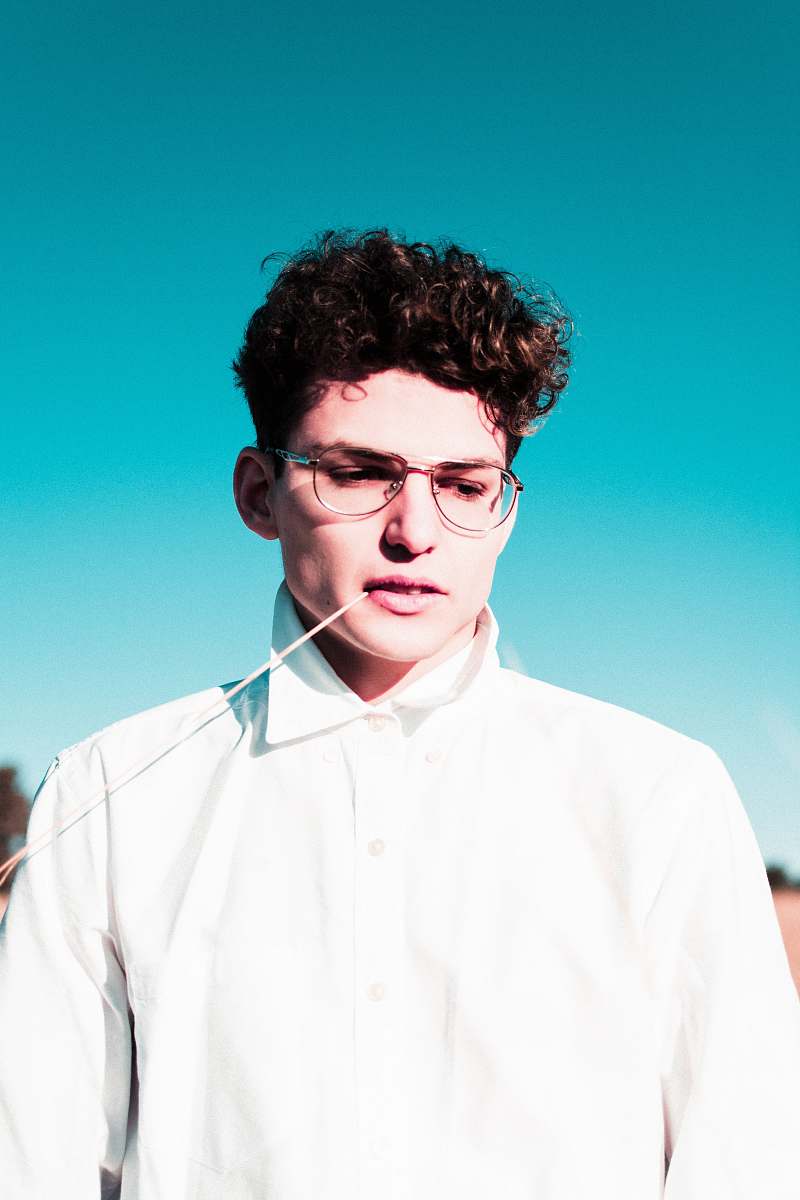 human man standing wearing eyeglasses people