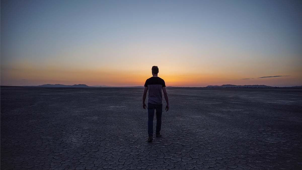 human man walking on desert people