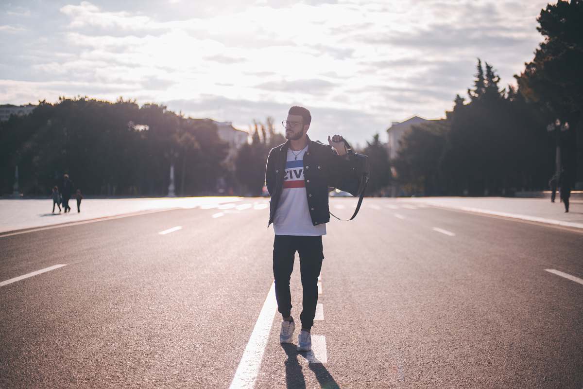 human man walking on street people