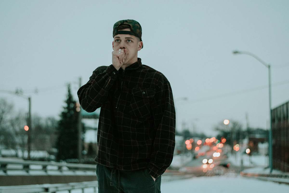 people man wearing black and brown flannel shirt human