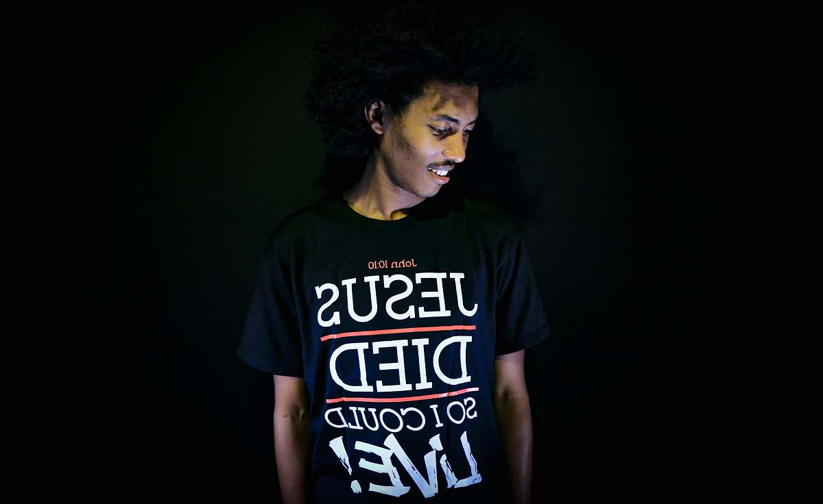 human man wearing black crew-neck t-shirt people