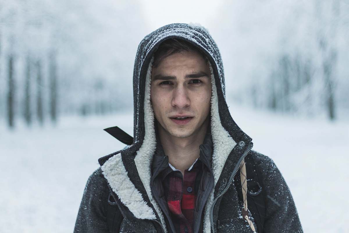 people man wearing black zip-up hooded jacket human
