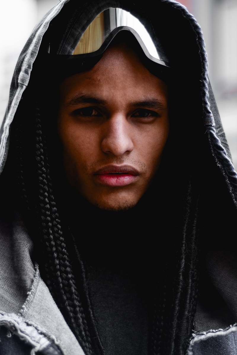 human man wearing grey hoodie with ski mask on forehead people