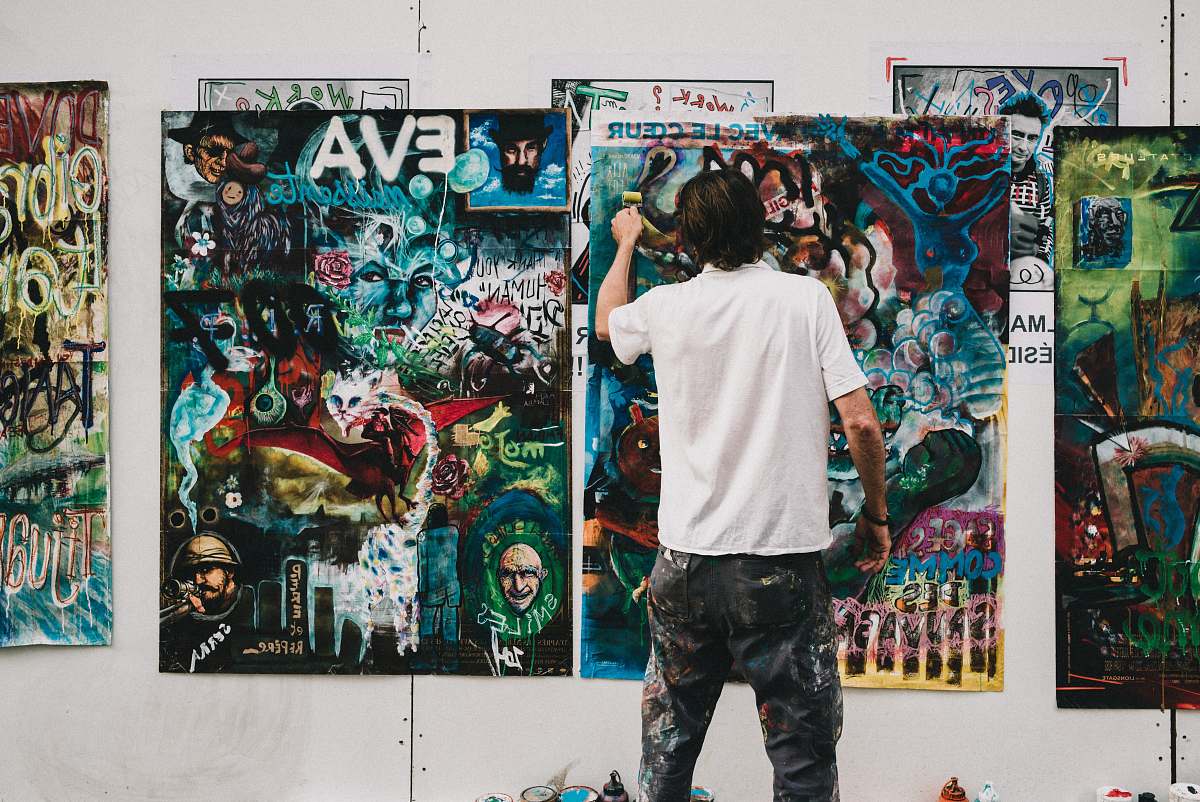 people man wearing white shirt painting a wall human