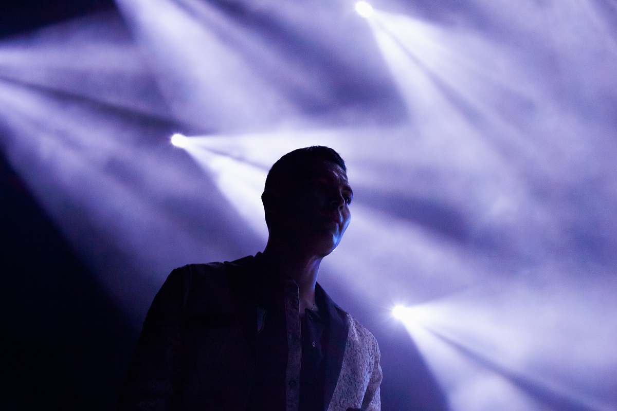 people man's silhouette on stage reflected by stage lights human