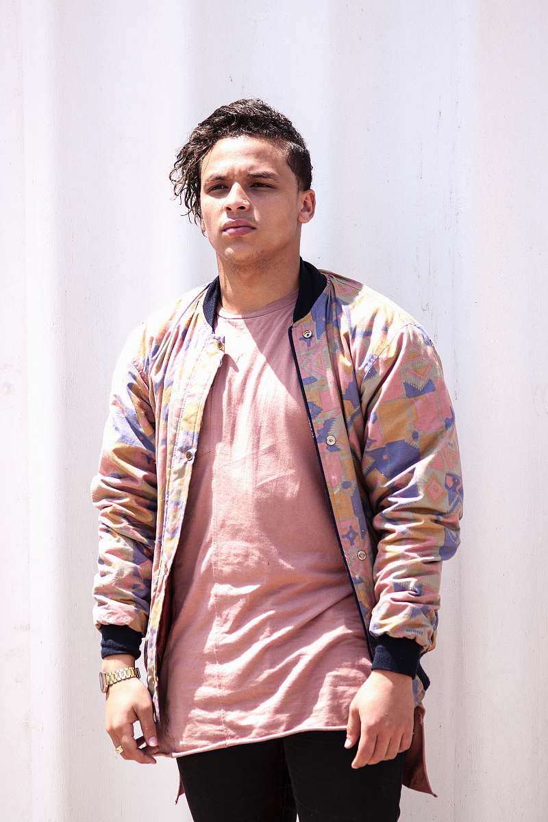 human men in pink and brown zip-up jacket standing people