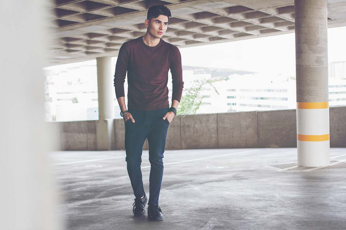 human men's maroon crew-neck shirt and jeans people