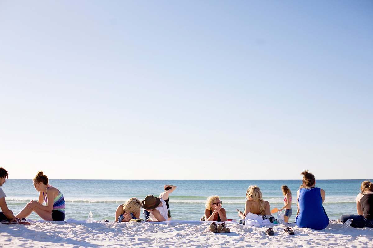 people people on white sands by the beach human
