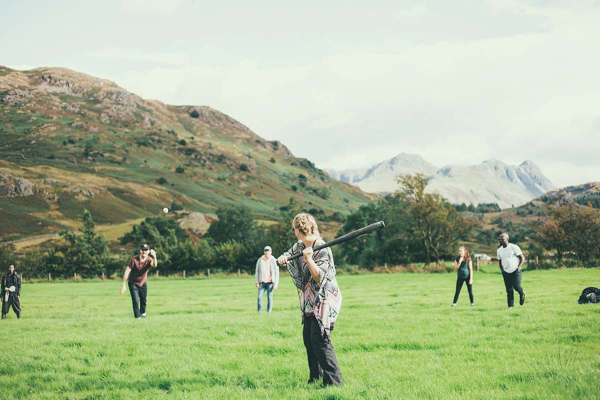 human people playing baseball game on green grass field during daytime people