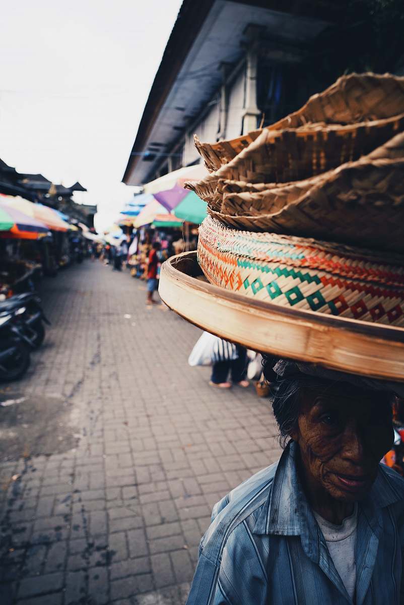 human people standing beside building during daytime market