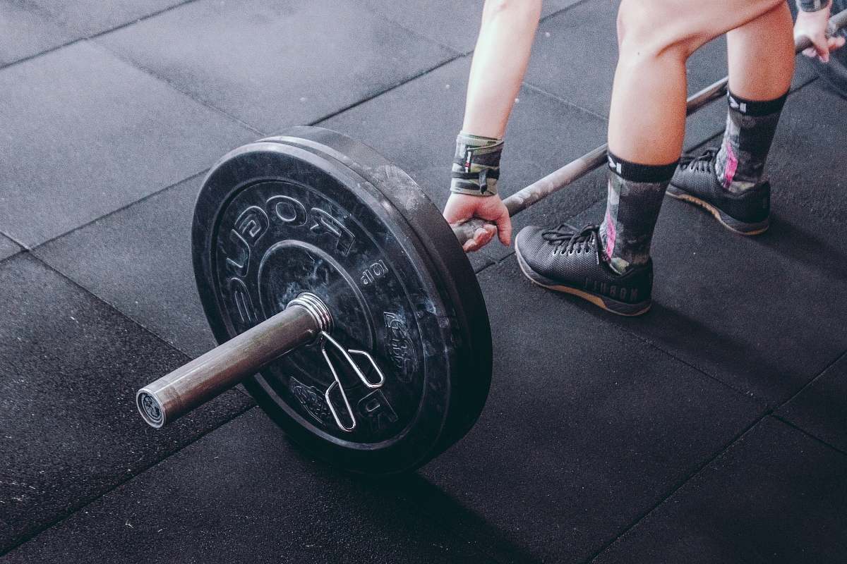 people person holding barbell human